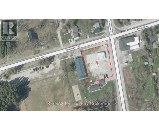 An aerial view of a property with a red outlined area and a blue pool in the middle.