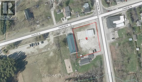 An aerial view of a property with a red outlined area and a blue pool in the middle.