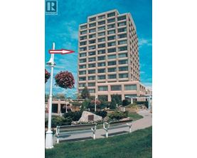 A tall building with a red arrow pointing to the left.