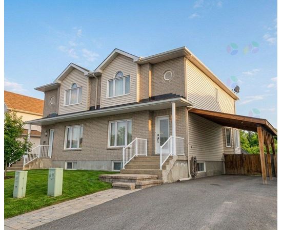 A two-story house with a garage on the right side.