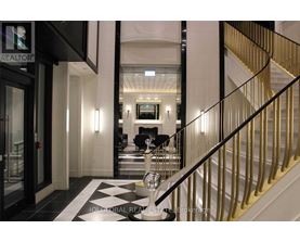 A staircase with a black and white checkered floor.