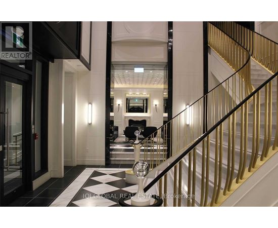 A staircase with a black and white checkered floor.