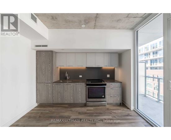 A modern kitchen with a stove top oven and a microwave.