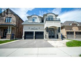 A large, two-story house with a garage is shown in the image.