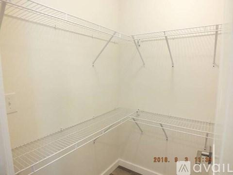 Empty white shelves in a room.