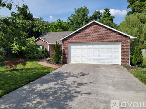 A house with a white garage door is for sale.