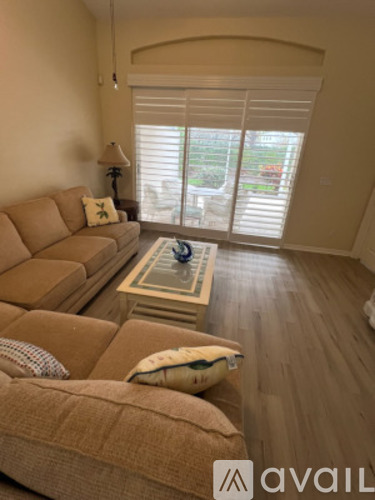 A living room with a couch and a coffee table.
