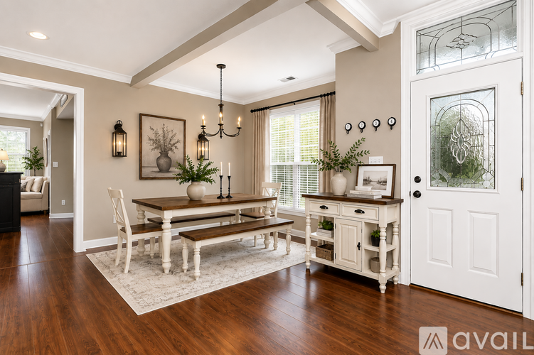 A dining room with a wooden table and chairs.