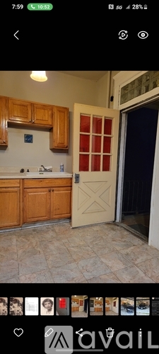 A kitchen with wooden cabinets and a white countertop.
