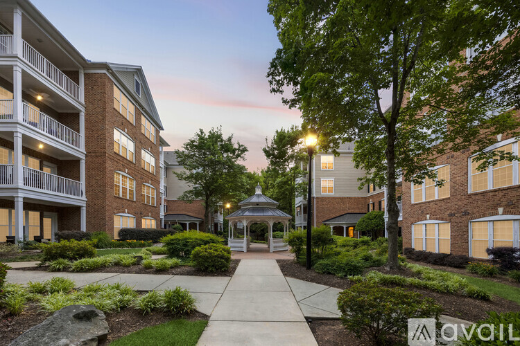 A residential area with apartment buildings and a gazebo.