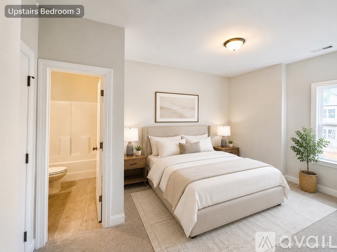 A bedroom with a large bed and a plant on the side table.