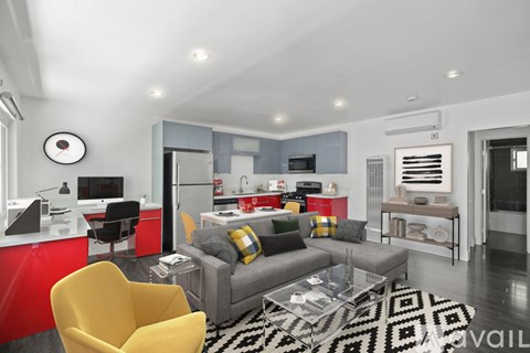 A modern living room with a yellow chair and a grey couch.