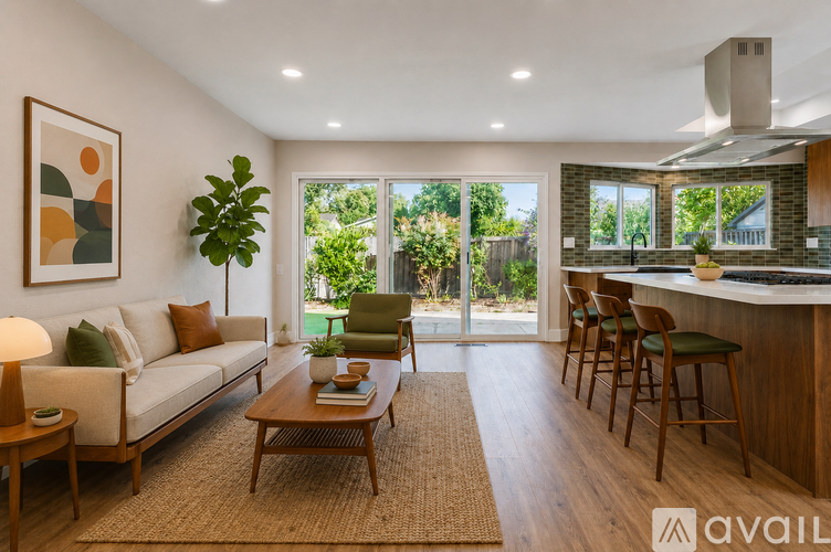 A living room with a couch, chairs, and a coffee table.