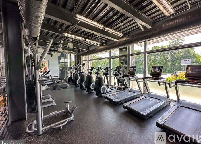 A gym with treadmills and other exercise equipment.