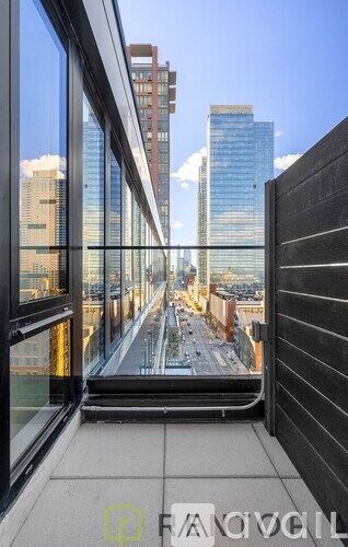 A view from a high-rise building looking down a city street.