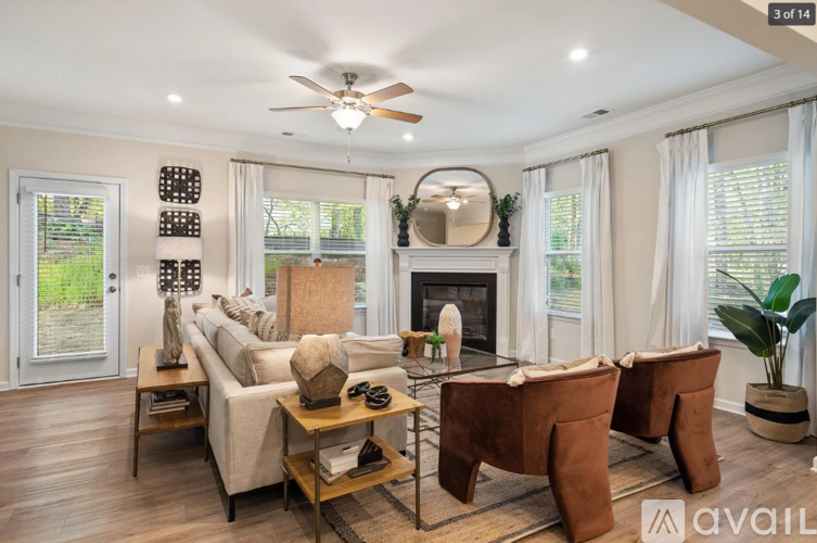 A living room with a fireplace, two couches, and a coffee table.