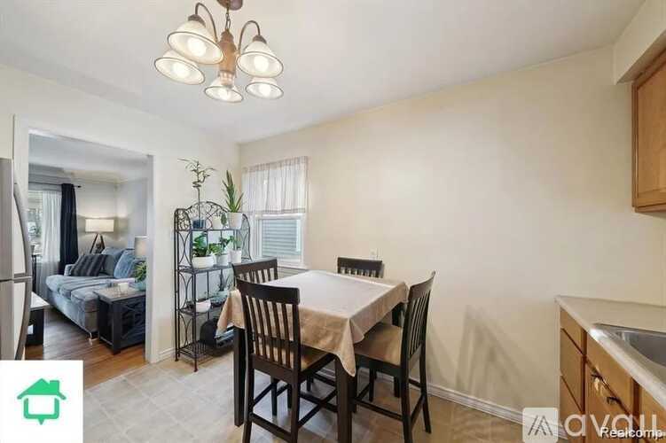 A well-lit dining area with a table set for four.