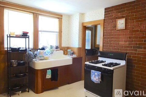 A kitchen with a stove and a sink.