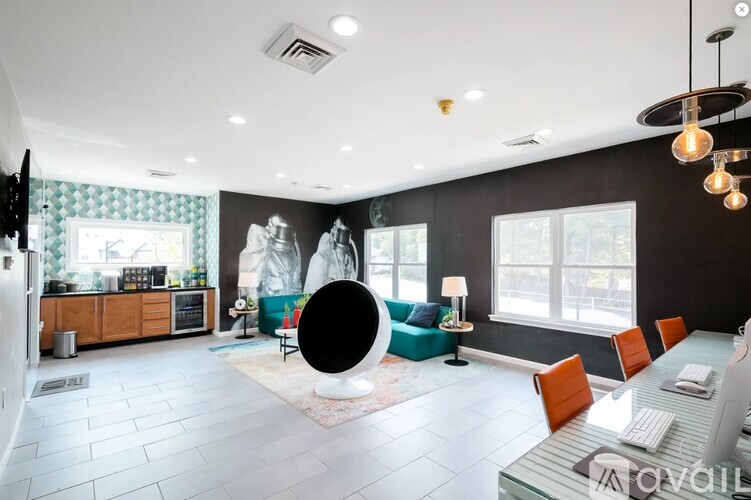 A modern living room with a black and white color scheme.