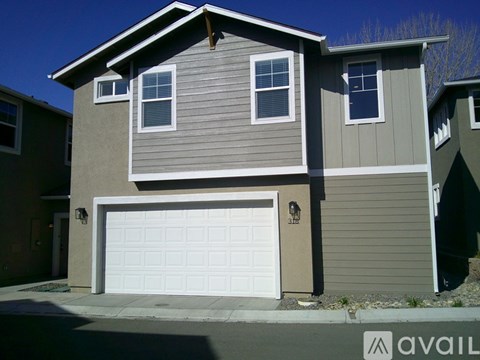 A house with a garage door that is closed.