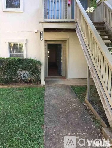 A building with a staircase leading to the entrance.