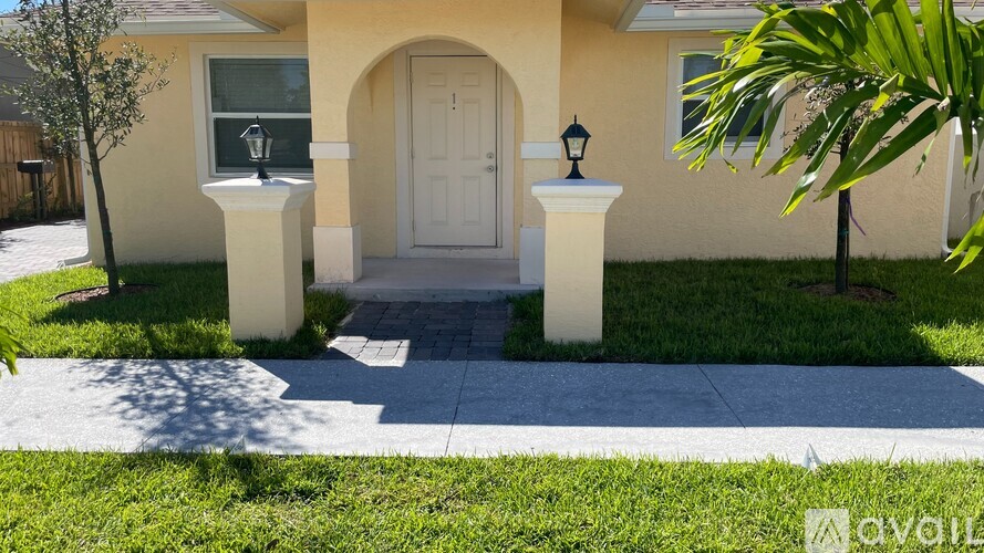 A house with a white door and a small porch.