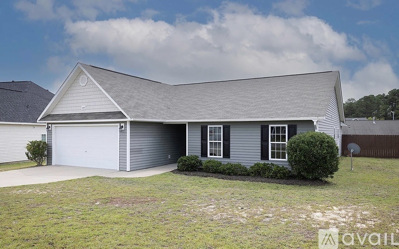 A two-car garage with a grey roof and white walls.