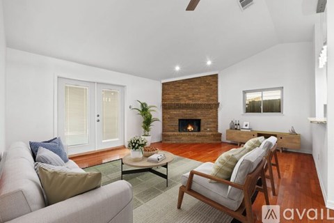 A living room with a fireplace and a couch.
