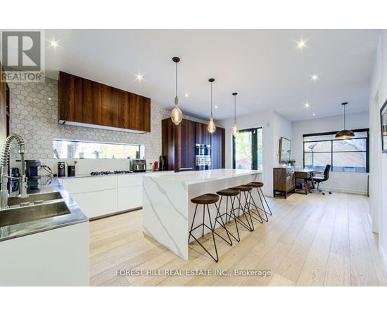 A modern kitchen with wooden cabinets and a white countertop.