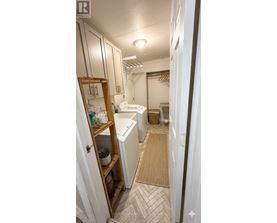 A bathroom with a white toilet and a white sink.