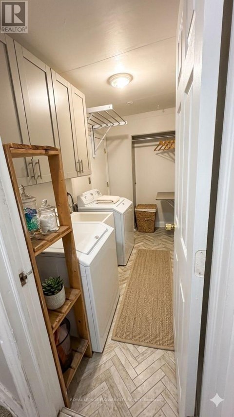 A bathroom with a white toilet and a white sink.