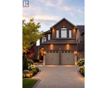 A house with a driveway and garage doors.