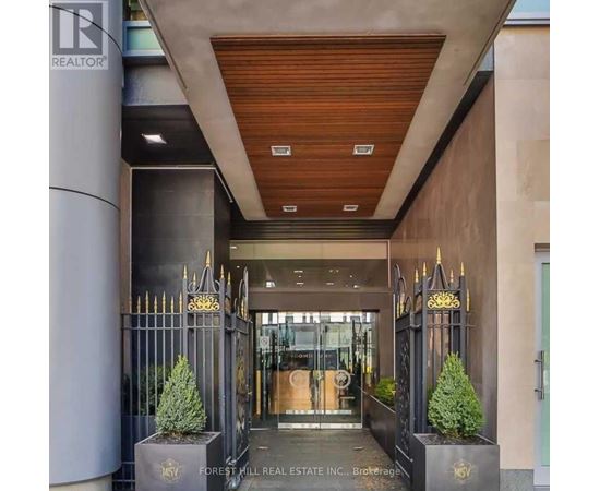 The image shows the entrance to a building with a sign that reads "REALTOR".