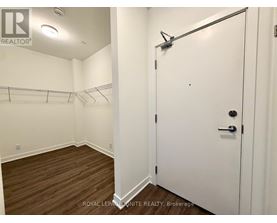 A white door with a black handle is closed.