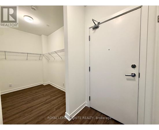 A white door with a black handle is closed.