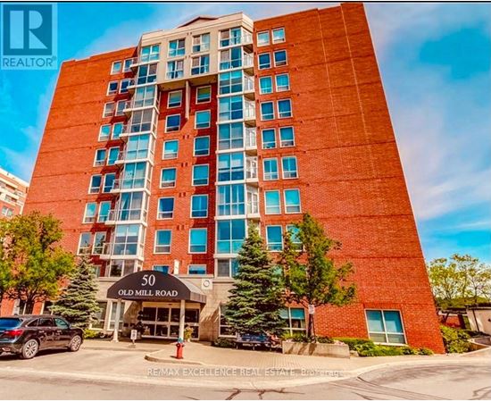 A tall red brick building with the number 50 on it.