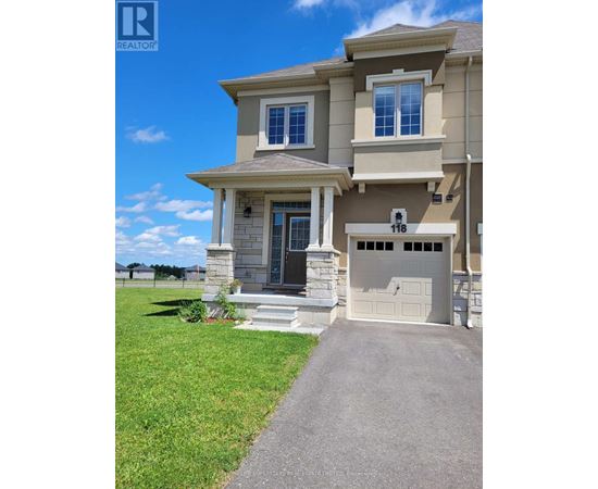 A two-story house with a garage and a driveway.