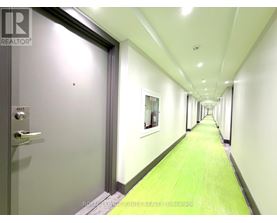 A long hallway with doors on either side.