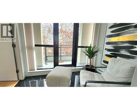 A realtor logo is visible on a glass door.