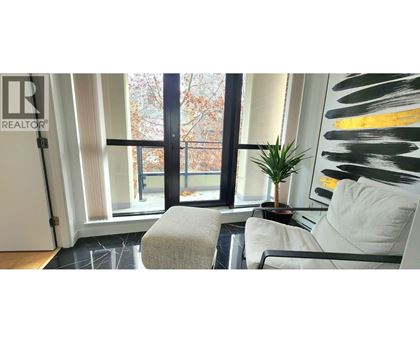 A realtor logo is visible on a glass door.