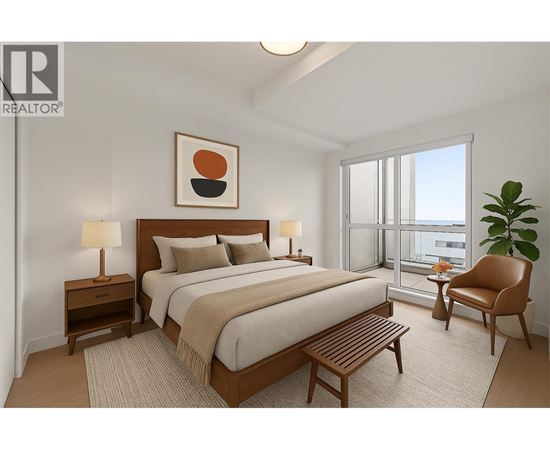 A bedroom with a large bed, a chair, and a plant.