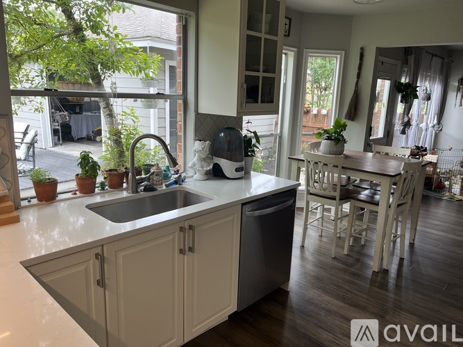 A kitchen with a sink and a window.