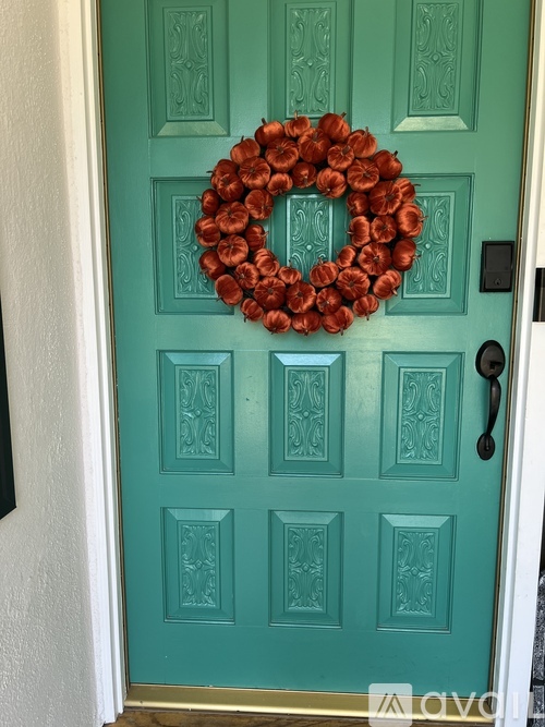 A door with a wreath on it.