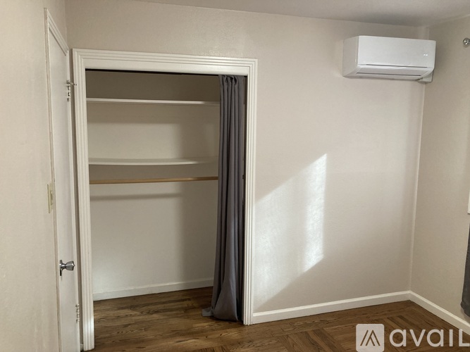 A small, empty room with a single open door.