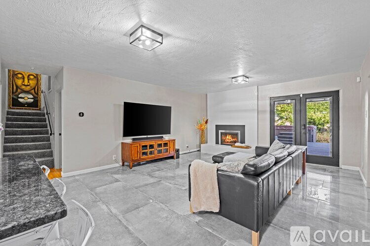 A living room with a fireplace and a couch.