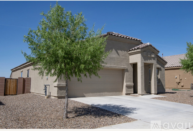 A house with a tree in front of it.
