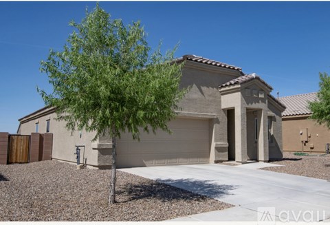A house with a tree in front of it.