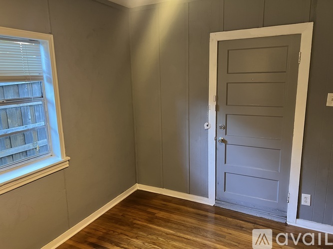 A room with a door and a window.