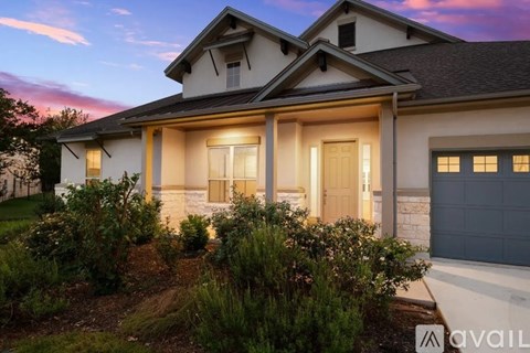 A house with a front yard and a garage.