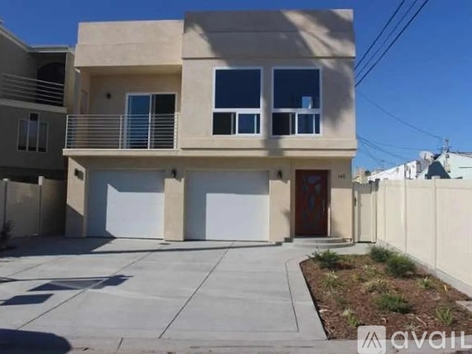 A two-story house with a garage is available for rent.